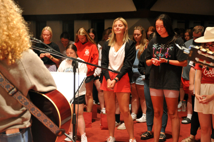 Central College students participating in worship activities.